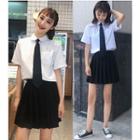 Short-sleeve Shirt With Tie / Pleated Skirt