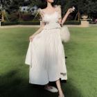Sleeveless Peplum Top / Pleated Maxi Skirt