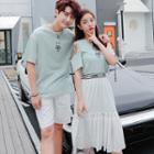 Couple Matching Set: Cutout Shoulder Short-sleeve T-shirt Dress + Lettering A-line Skirt / Printed Short-sleeve T-shirt / Plain Shorts