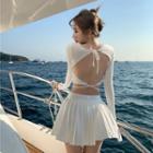 Long-sleeve Open Back Drawstring Cropped Top / High-waist Plain Pleated Skirt