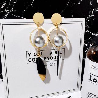 Non-matching Feather Statement Earrings