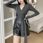 V-neck Long Sleeve Tie-waist Wrap Top / High Waist Zip-up Faux-leather Mini Skirt / Chain Suspender