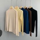 Turtle-neck Ruffle-hem Plain Knit Top