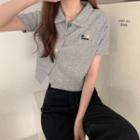 Asymmetrical Short-sleeve Star Embroidered Polo Knit Top