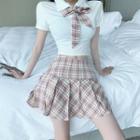 Set: Short-sleeve Tied Polo Shirt + Plaid Pleated Mini Skirt