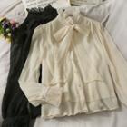 Ribbon-neckline High-collar Loose Shirt