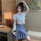 Set: Short-sleeve Zip-up Polo Top + Pleated A-line Skirt