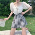 Puff-sleeve Bow Top / Checked A-line Mini Skirt