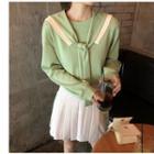 Plain Tie-neck Pullover / Letter Embroidered Mini Pleated Skirt
