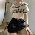 Short-sleeve Collar Knit Top / Pleated Mini A-line Skirt