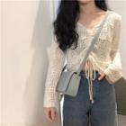 Long-sleeve Perforated Drawstring Knit Top