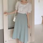 Puff-sleeve Buttoned Floral Print Blouse / Irregular A-line Midi Skirt