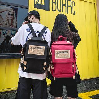Letter Tagged Backpack