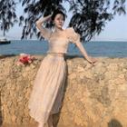 Set: Short-sleeve Floral Blouse + A-line Skirt