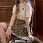 Plaid Pleated Mini A-line Skirt / Elbow-sleeve Polo Shirt