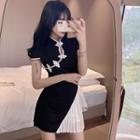 Set: Short-sleeve Asymmetrical Frog Buttoned Top + A-line Skirt