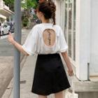 Short-sleeve Open-back T-shirt / Mini Pleated Skirt