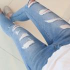 Low-rise Distressed Skinny Jeans