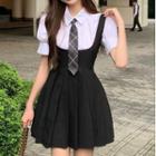 Short-sleeve Tie Neck Shirt / Mini A-line Pleated Suspender Skirt