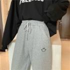 Smiley Face Embroidered Crop Pants