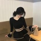 Long-sleeve Peplum Knit Top