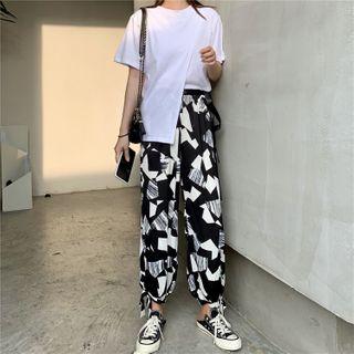 Asymmetric Short-sleeve T-shirt / Patterned Jogger Pants