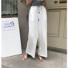 Sleeveless T-shirt / Drawstring Wide-leg Pants