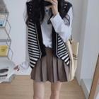 Long Sleeve Plain T-shirt / Striped Button-up Knit Vest / Pleated Mini Skirt