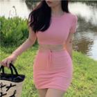 Set : Round-neck Short-sleeve Cropped Top + High-waist Cross-strap Pencil Skirt Pink - One Size