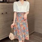 Set: Eyelet Panel Short-sleeve Blouse + Floral Midi A-line Skirt