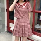 Plaid Short-sleeve Blouse / Mini Pleated Skirt