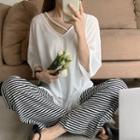 Elbow-sleeve V-neck T-shirt / Striped Straight Leg Pants