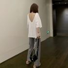 Open-back Plain T-shirt / Striped Wide-leg Pants