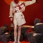 Mock-neck Cartoon Jacquard Sweater / Tasseled Faux Leather Mini A-line Skirt