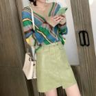 V-neck Striped Sweater / Irregular Faux Leather A-line Skirt