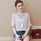 Embroidered Tasseled Tie Front Elbow Sleeve Top