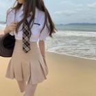 Short-sleeve Tie Neck Shirt / Mini A-line Pleated Skirt