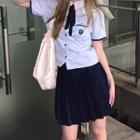 Short-sleeve Tie-front Logo Embroidered Shirt / Pleated Mini A-line Skirt