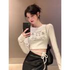 Long-sleeve Cross Print Cropped T-shirt