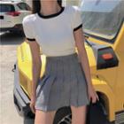Short-sleeve Knit Top / Plaid Pleated Mini Skirt