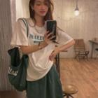 Set: Short-sleeve Lettering T-shirt + Skirt + Crossbody Bag