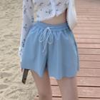 Long-sleeve Floral Crop Top / Faux Leather Wide-leg Shorts