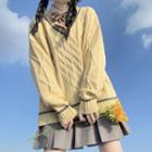 Cable-knit Sweater / Mini Pleated Skirt / Bow Tie