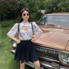 Short-sleeve Cutout Floral Shirt / High-waist Pleated Skort