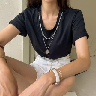 T-shirt With Medallion Necklace