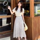 Round-neck Plain Short-sleeve Top / High-waist Floral Skirt