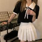 Short-sleeve Bow-accent Shirt + Pleated Mini Skirt