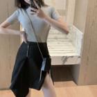 Short-sleeve Plain Tee / High-waist Asymmetric Split Hem Skirt