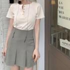 Short-sleeve Henley T-shirt / High-waist Pleated Mini A-line Skirt