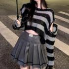 Striped Cropped Sweater / Pleated Faux Leather Mini Skirt